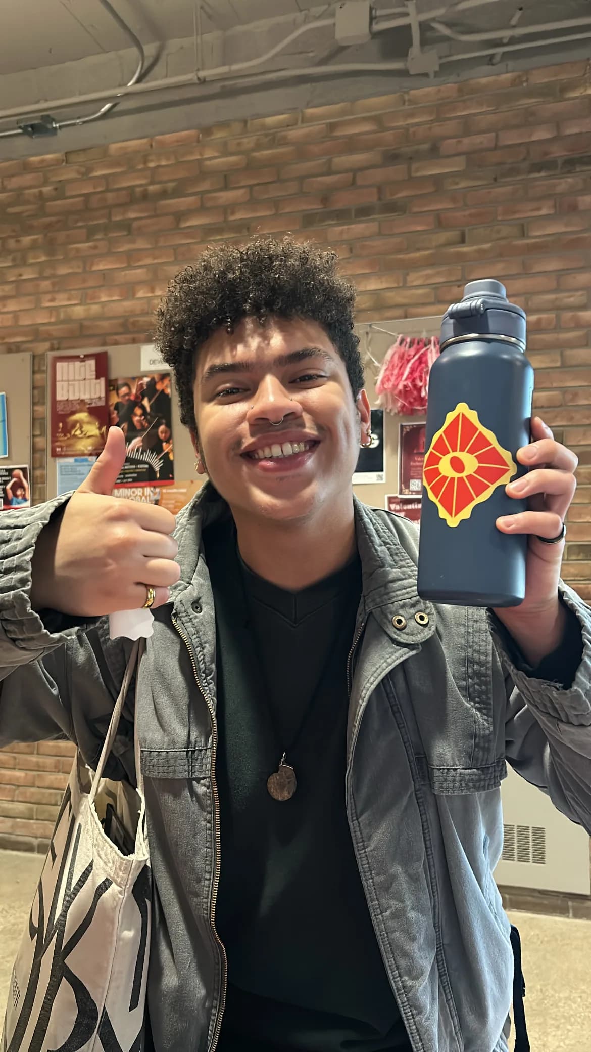 Supporter holding East Zodiac merchandise